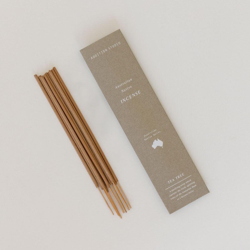 Australian Native Incense from Addition Studio, including Tea Tree sticks, can be seen on a white surface.