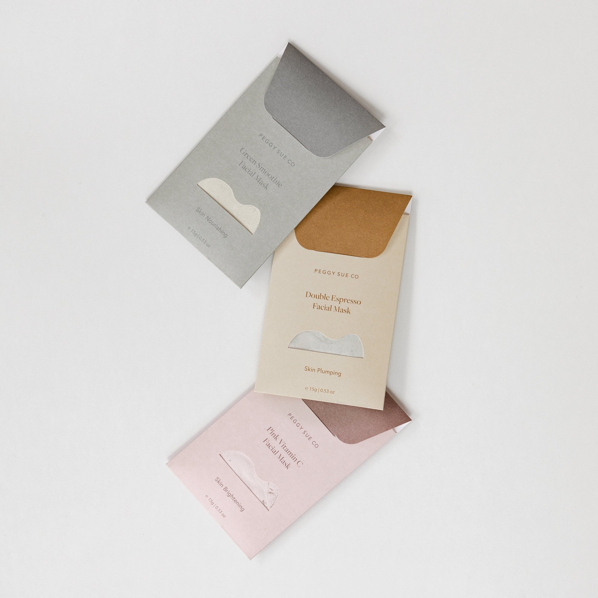 Three different types of biglittlegifting face mask kits on a white surface.
