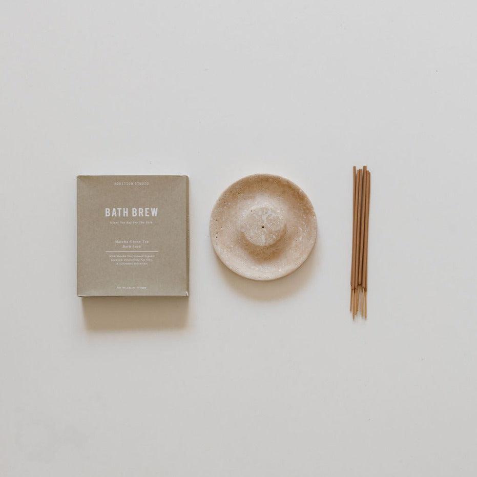 An cense & soak incense burner and a box of cense & soak incense sticks on a white surface from biglittlegifting.