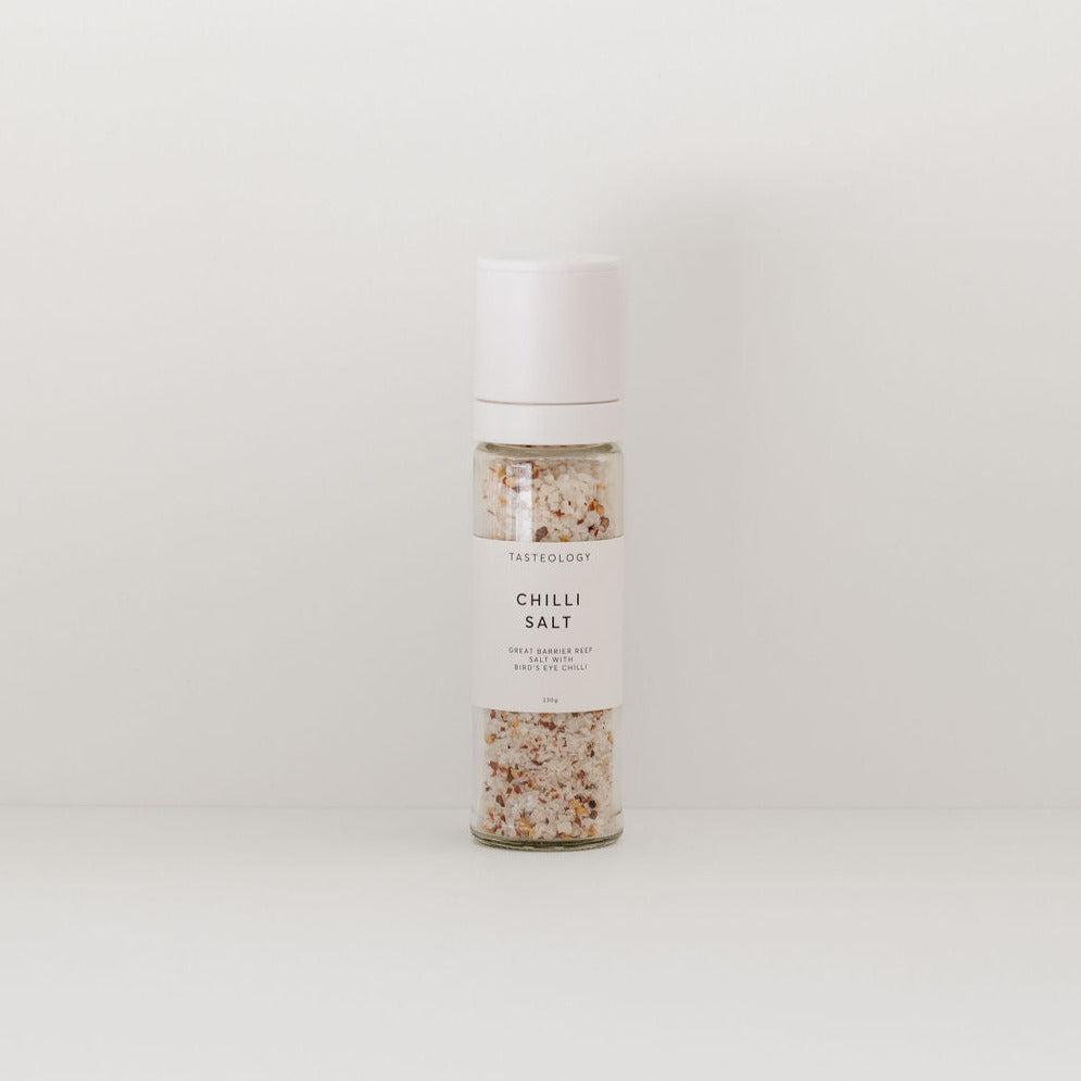 A bottle of Tasteology chilli salt on a white background.