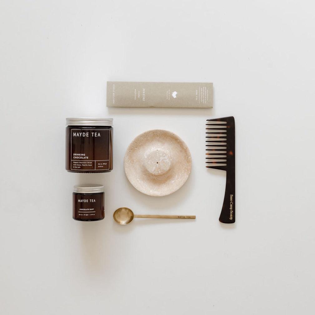 A hair care kit with a comb, brush, and chocolate bliss by biglittlegifting.