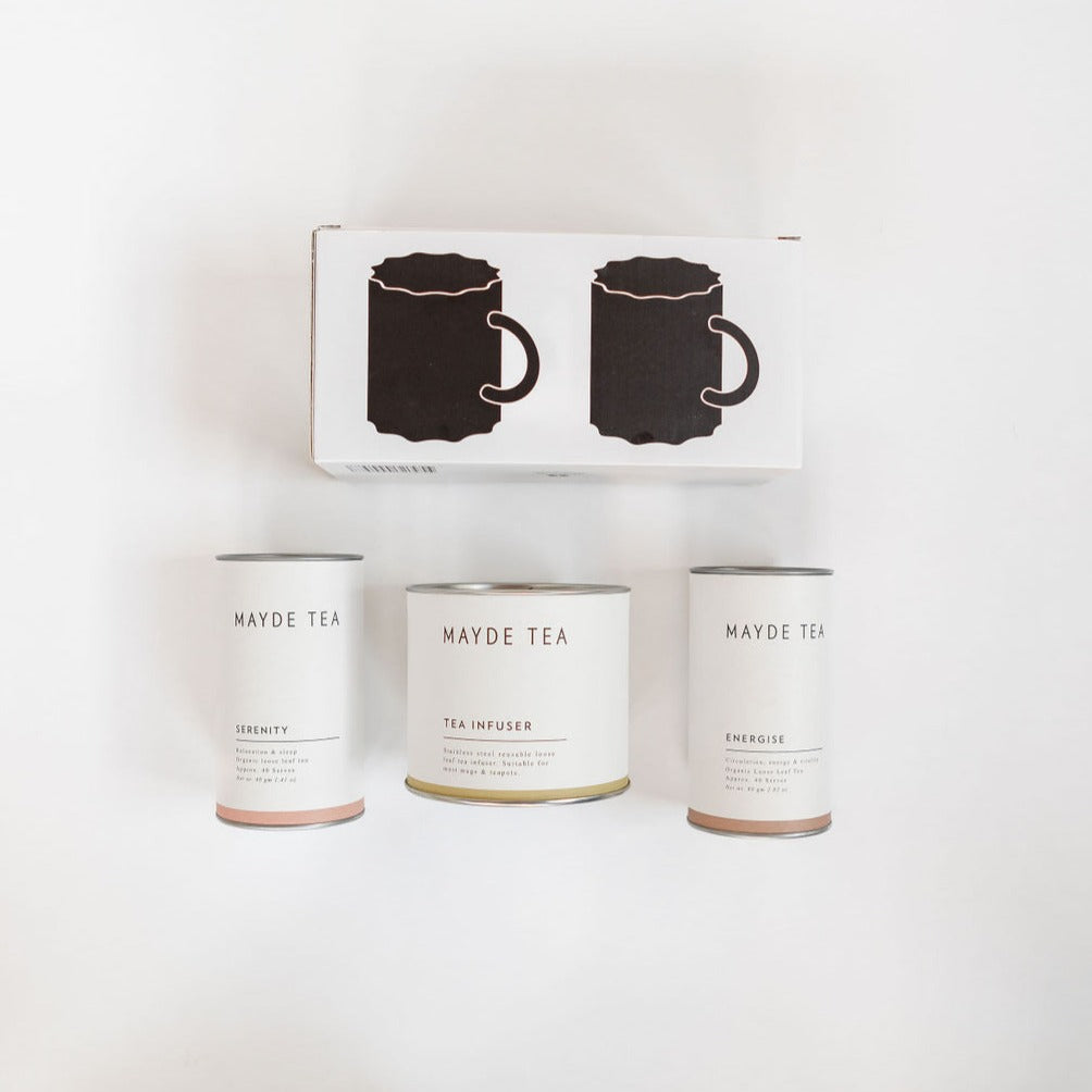 A tea gift kit featuring "the tea for two kit" by biglittlegifting, consisting of a box of tea and a mug on a white surface.