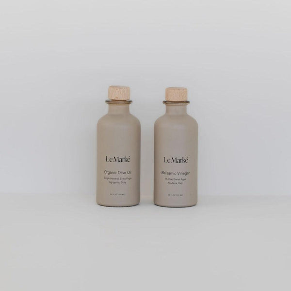 Two bottles of Le Marké tavola set on a white background.