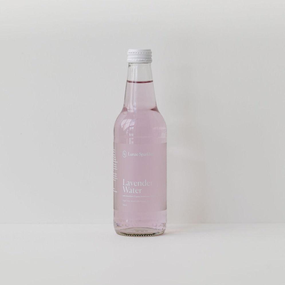 A bottle of Lunae Sparkling lavender water on a white background.