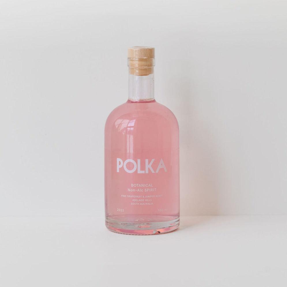 A bottle of non-alcoholic botanical spirit on a white background.