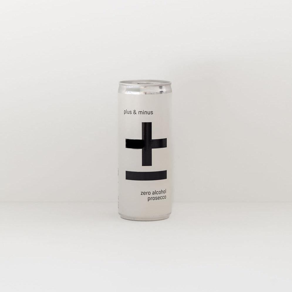 A can of Plus & Minus non-alcoholic Prosecco with a large black plus and minus sign on a white background.
