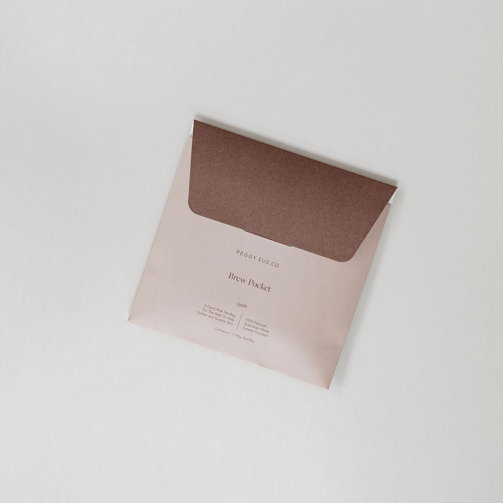 A Uplift | brew pocket by Peggy Sue Co. sitting on a white surface.