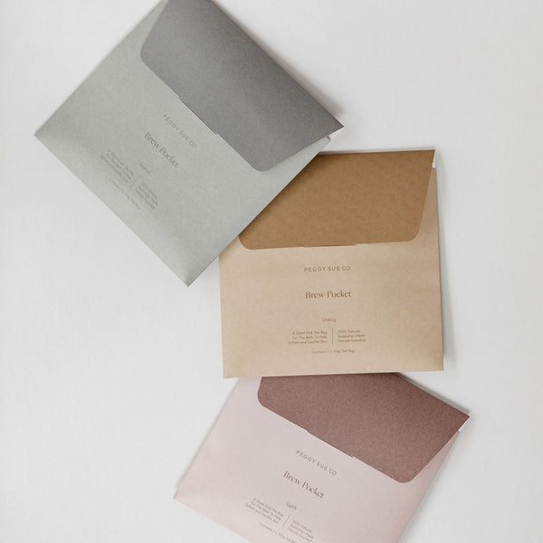 Three Uplift | brew pocket envelopes on a white surface by Peggy Sue Co.