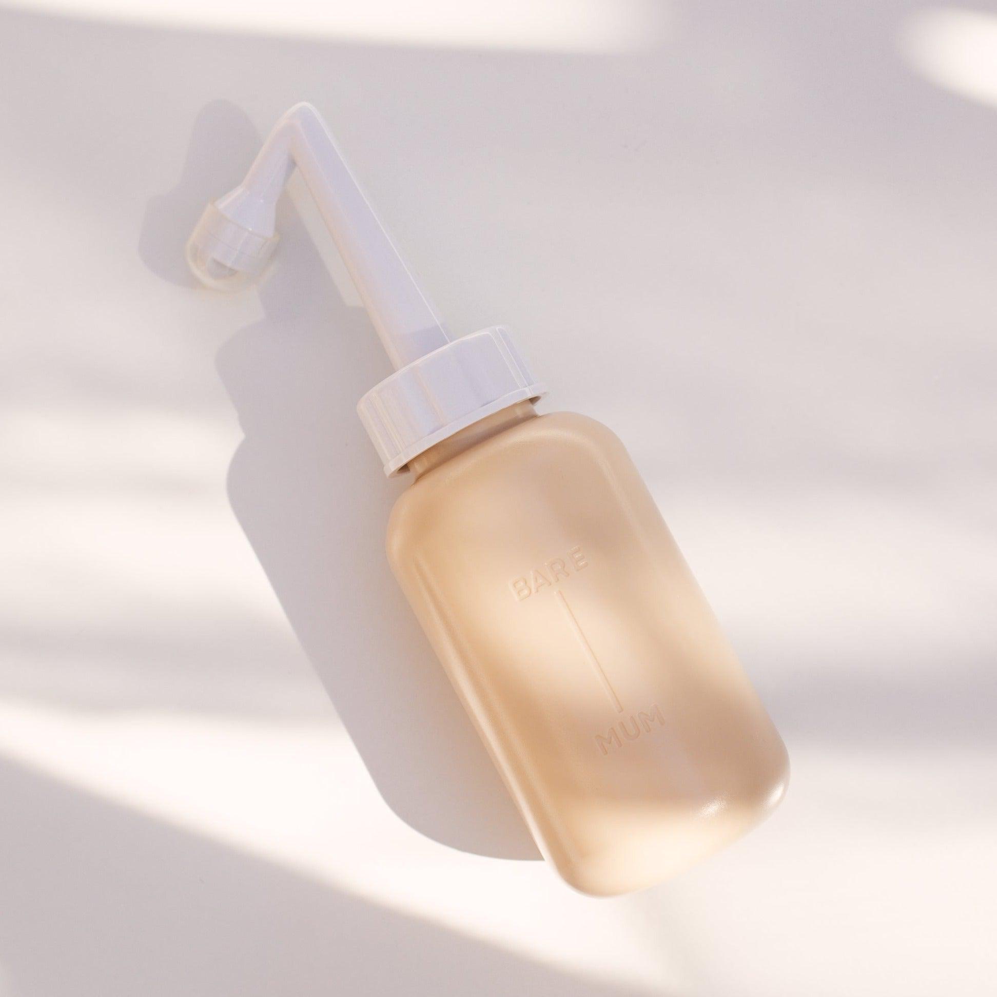 An easy to use, mess free, perineal wash bottle designed to relieve the sting of urine and gently cleanse sensitive areas.  Make your postpartum recovery more comfortable with our ergonomic wash bottle that gently and effectively cleanses your vulva, perineum, or site of a c-section, without pressure. 