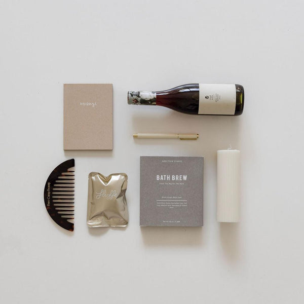 A bottle of savour the moment wine and a biglittlegifting gift box, perfect for gifting.