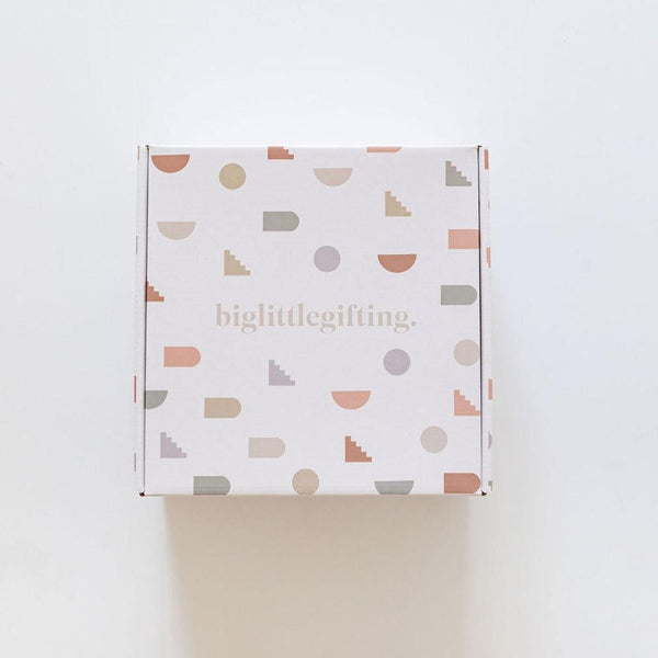 A white box with biglittlegifting shapes on it.