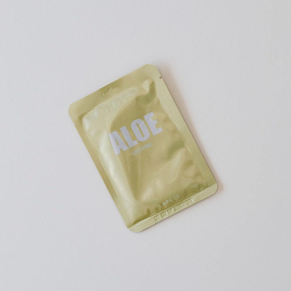 A packet of Lapcos sheet face mask soothing on a white surface.