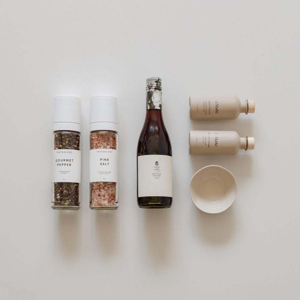 A bottle of the foodie & wine, a bottle of water and a bottle of salt by biglittlegifting.