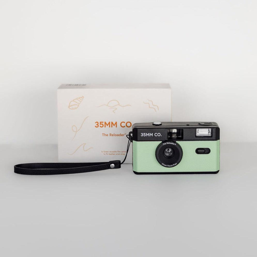A 35mm mint green reloader® reusable film camera with a mint green strap and box.