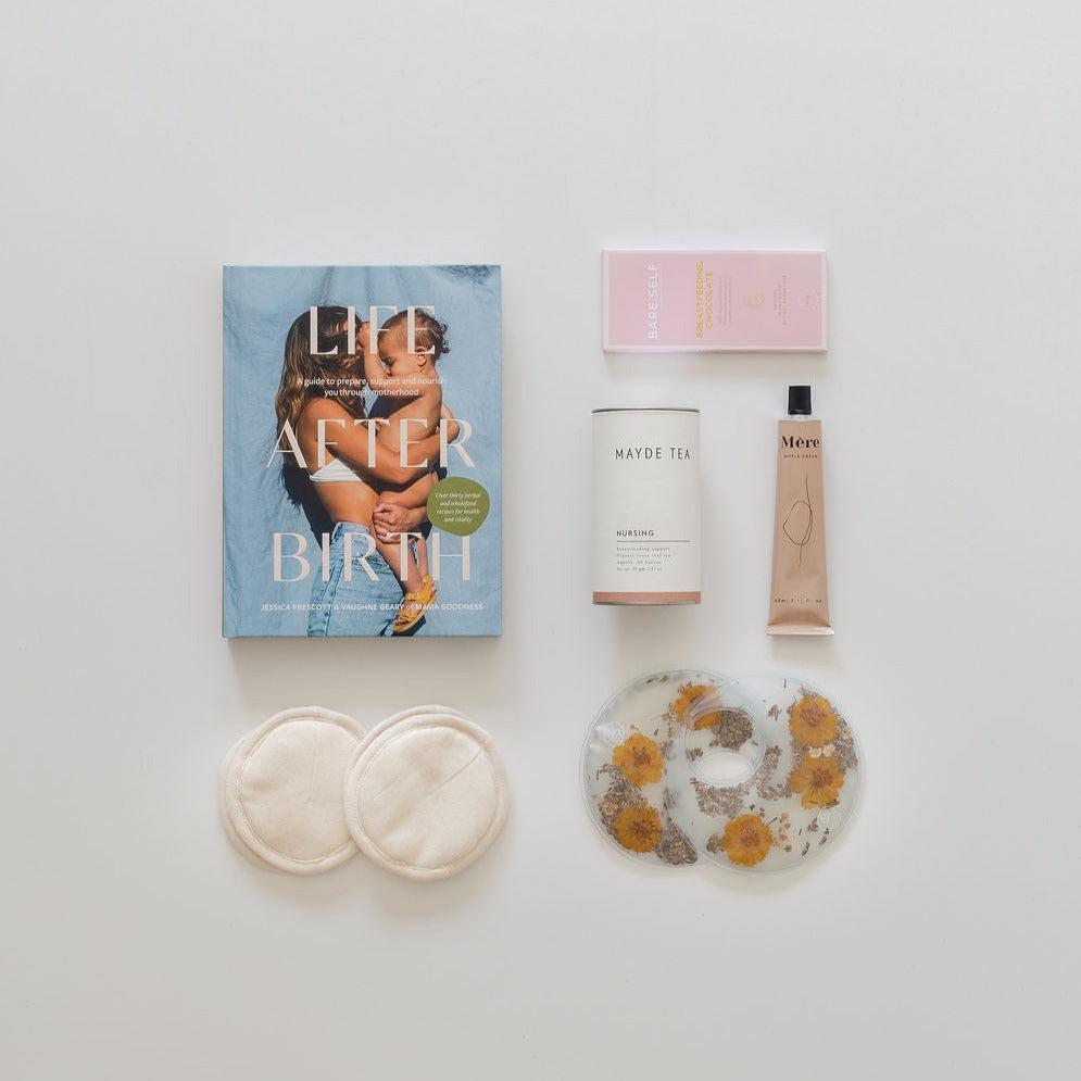 A collection of baby items, including the ultimate breastfeeding kit by biglittlegifting.
