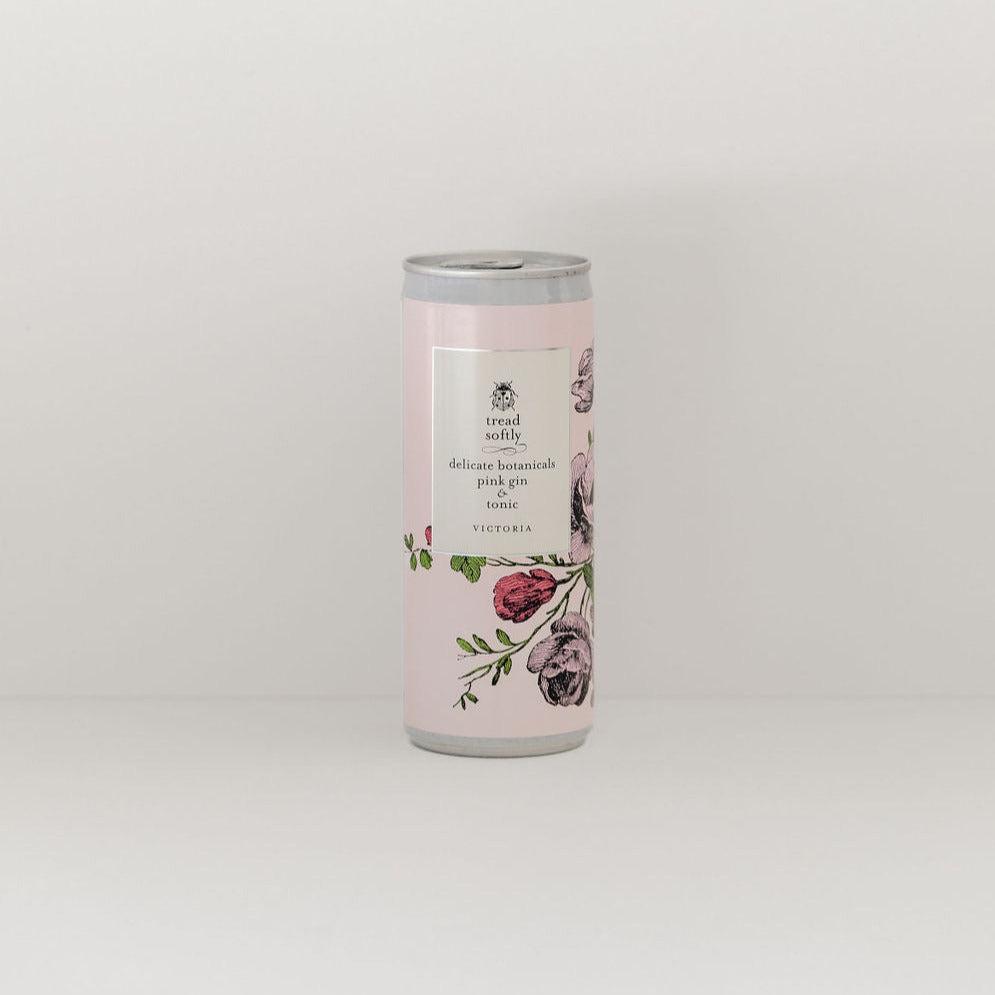 A pink canister with roses on it designed to support Australian Native Tree planting and carbon footprint reduction efforts through the Tread Softly Forest initiative featuring the tread softly | botanical pink gin & tonic by Tread Softly.