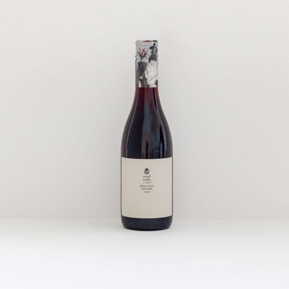 A Tread Softly pinot noir 375ml bottle with a muted label and a sealed cork from sustainable wine-making, displayed against a plain white background.