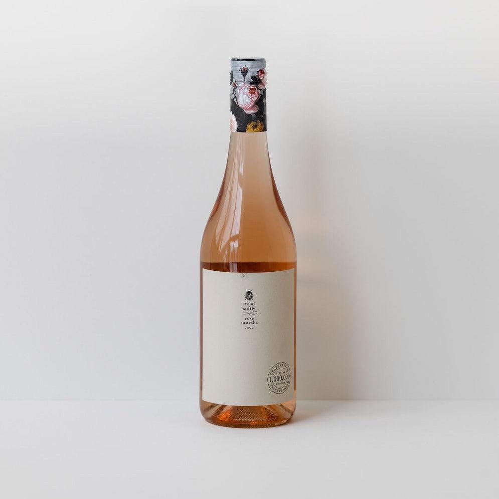 A bottle of Tread Softly rosé wine on a white background.