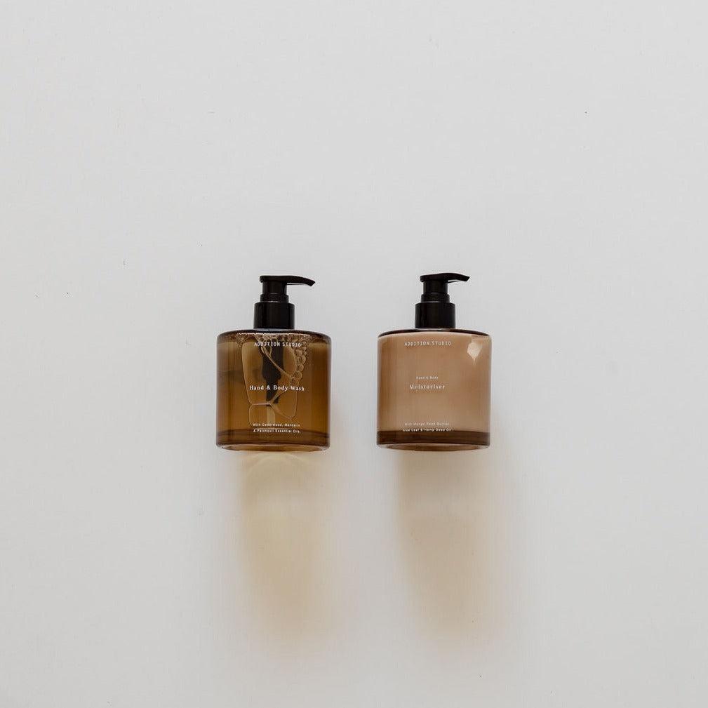 Two biglittlegifting wash & moisturise essentials bottles of soap on a white surface.