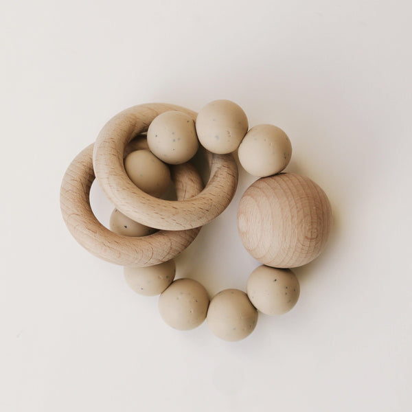 Wooden Silicone Teether and BPA free silicone teething rings by Dove & Dovelet on a white background.